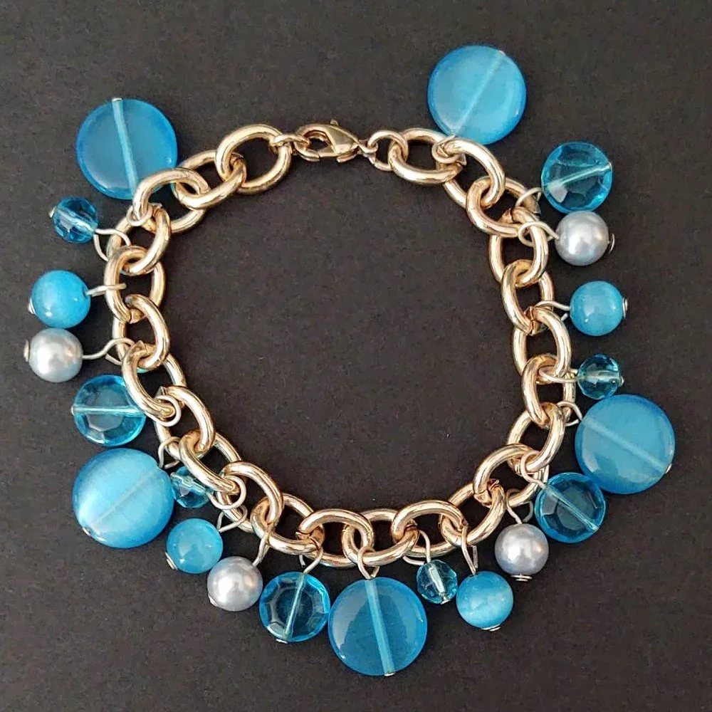 Blue bead and faux pearl charm style bracelet